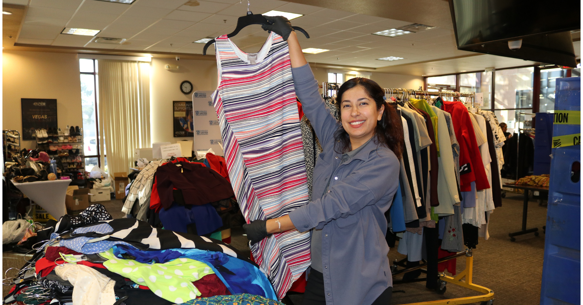 UWSN Team Member Fabi sorting clothes for the Women United Suit Drive