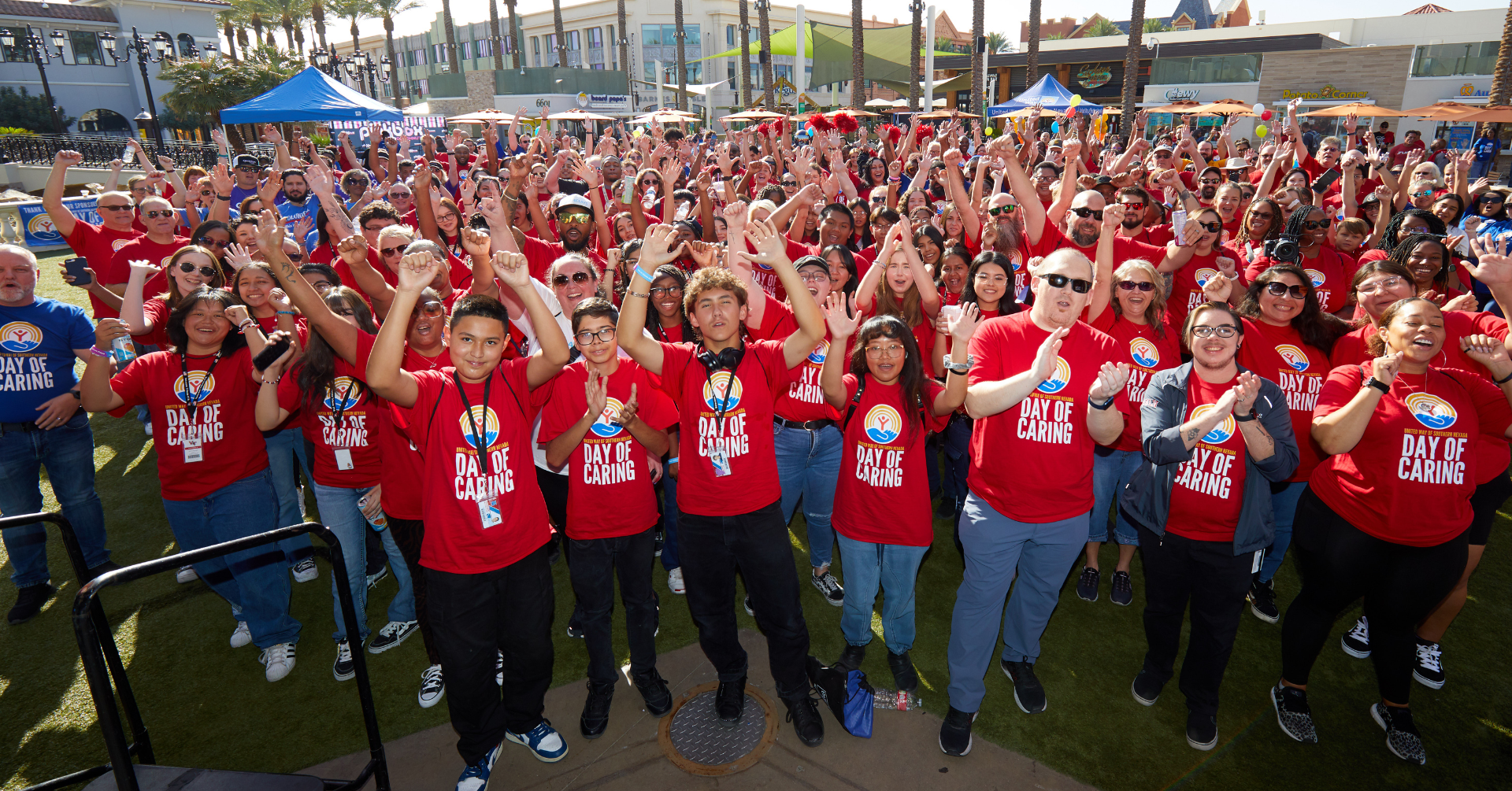 Large group of Day of Caring volunteers smiling at the camera