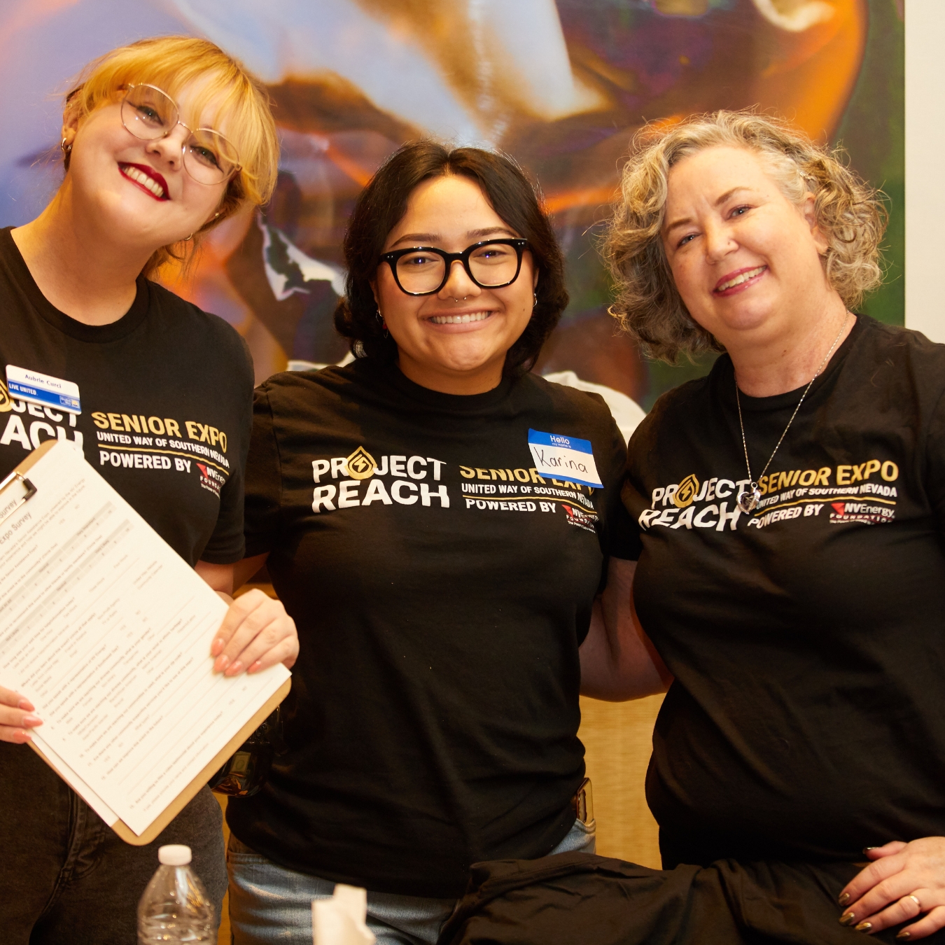 three ladies smiling