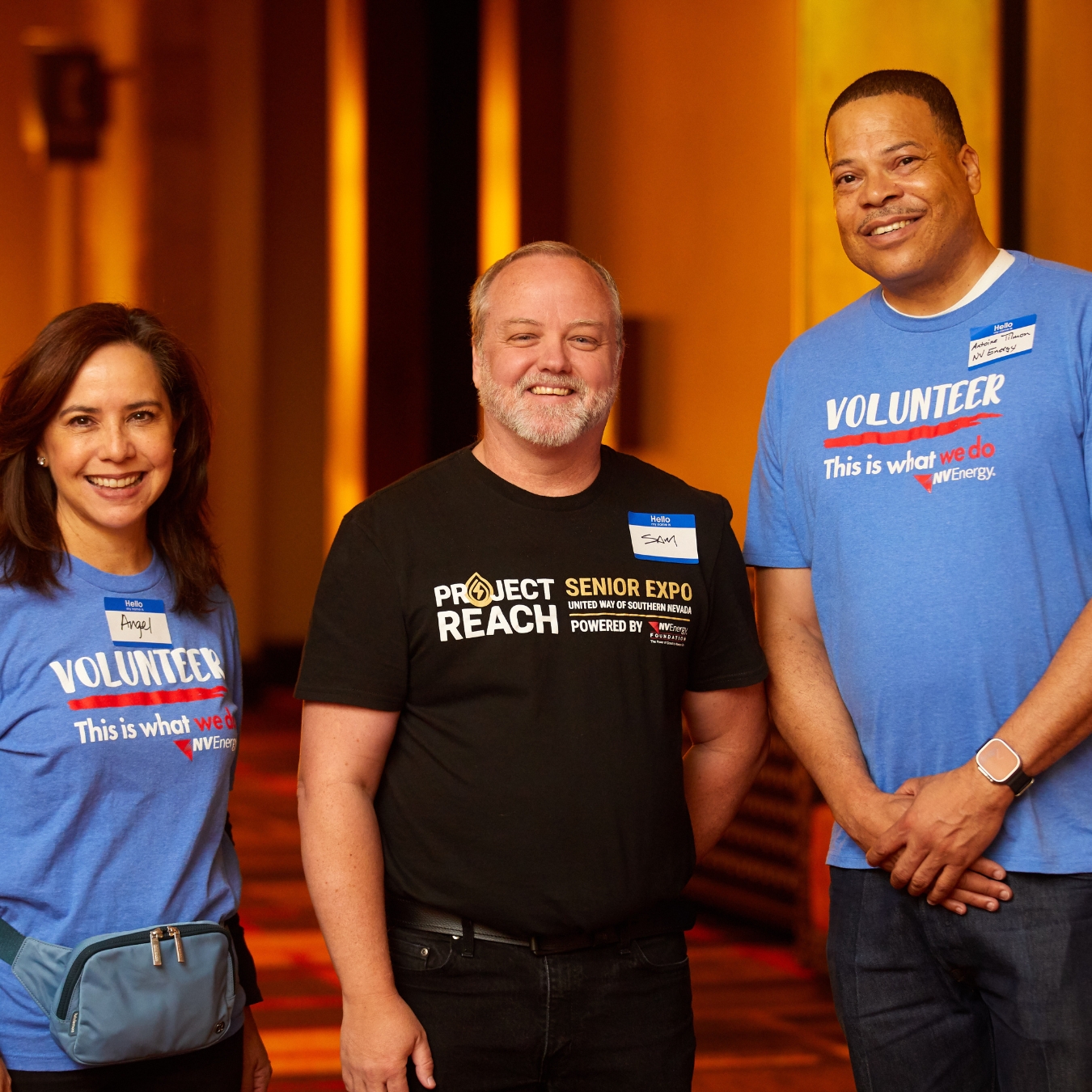 three people smiling