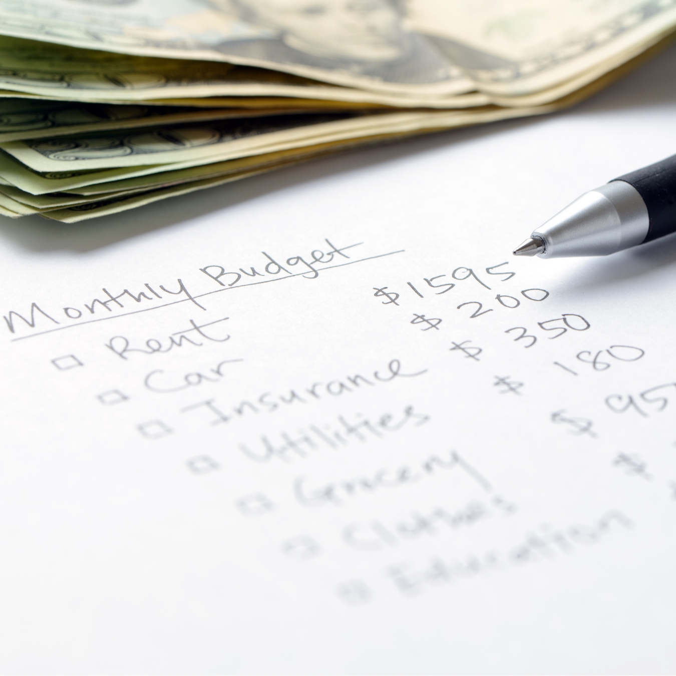 monthly budget paper and pen