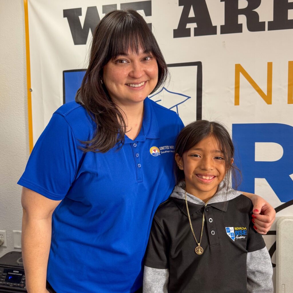 United Readers mentor with arm around student